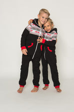 Load image into Gallery viewer, Sofa Killer black unisex kids onesie Nordic displayed on two playful kids embracing, showcasing the stylish red pocket details and comfortable design for all-day fun.