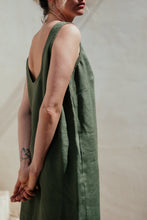Load image into Gallery viewer, Model wearing Women's dark green linen sleeveless dress Lola by SofaKiller, showcasing the relaxed fit and low back design.