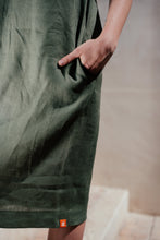 Load image into Gallery viewer, Close-up of the Women's dark green linen sleeveless dress Lola by SofaKiller, highlighting the fabric and functional side pockets.