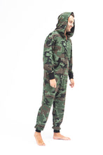 Load image into Gallery viewer, Sofa Killer men onesie with camouflage pattern CAMO, shown on a model wearing it with the hood up, highlighting the casual and comfortable fit.