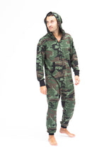 Load image into Gallery viewer, Sofa Killer men onesie with camouflage pattern CAMO, designed for comfort and style. The model showcases the onesie, featuring a stylish hood and black details, perfect for cozy adventures.