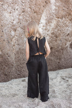 Load image into Gallery viewer, Sofa Killer linen black girl set highlighting the back view of a young girl wearing a black linen top and trousers, perfect for any special occasion.