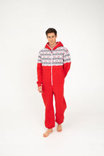 Load image into Gallery viewer, Model walking in a Sofa Killer red onesie with Nordic applications, emphasizing the relaxed style and vibrant color of this comfortable winter outfit.