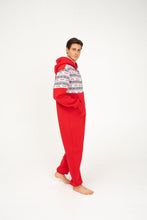 Load image into Gallery viewer, Side view of a model in a Sofa Killer red onesie with Nordic applications, demonstrating the cozy fit and festive motifs ideal for holiday lounging.