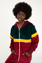 Load image into Gallery viewer, Close-up of Sofa Killer women velour onesie California, model smiling while wearing the colorful zip-up hoodie.