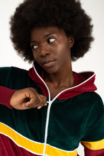 Load image into Gallery viewer, Model wearing Sofa Killer women velour onesie California, looking chic with an expressive pose.