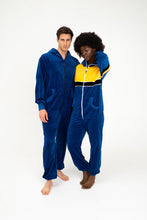 Load image into Gallery viewer, Sofa Killer men royal blue velour onesie Nevada worn by a male model alongside a female model in a colorful velour onesie.
