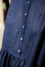 Load image into Gallery viewer, Detailed view of the button-down front of the Women's dark blue linen sleeveless dress Costa Blanca by SofaKiller, highlighting its chic and minimalist design.
