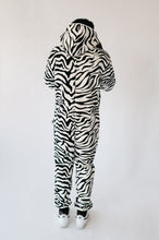 Load image into Gallery viewer, Back view of a man in a Sofa Killer animal men onesie Zebra, showcasing the unique zebra pattern.
