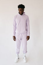 Load image into Gallery viewer, Front view of a model wearing the Sofa Killer men hoodie Medusa in light violet, showcasing the stylish design and embroidered logo.
