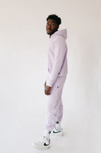 Load image into Gallery viewer, Profile view of a model in Sofa Killer men hoodie Medusa, dressed in light violet, with a casual and confident vibe.
