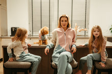 Load image into Gallery viewer, A dog onesie style vintage outfit showcased in a cozy setting with a woman and two girls, featuring stylish matching loungewear.
