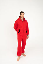 Load image into Gallery viewer, Sofa Killer red onesie with black zipper worn by a young man, showcasing its cozy design against a plain backdrop.
