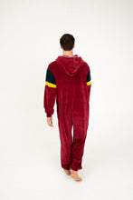 Load image into Gallery viewer, Back view of a model wearing Sofa Killer men velour onesie California in bordo with green and yellow accents.
