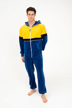 Load image into Gallery viewer, Model wearing Sofa Killer men velour onesie Dakota in royal blue and yellow, showcasing comfort and style.
