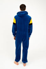 Load image into Gallery viewer, Back view of the Sofa Killer men velour onesie Dakota, highlighting the cozy royal blue fabric and hood, worn by a man.
