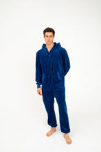 Load image into Gallery viewer, Sofa Killer men royal blue velour onesie Nevada, model standing confidently in a royal blue velour onesie, showcasing its comfort and style.
